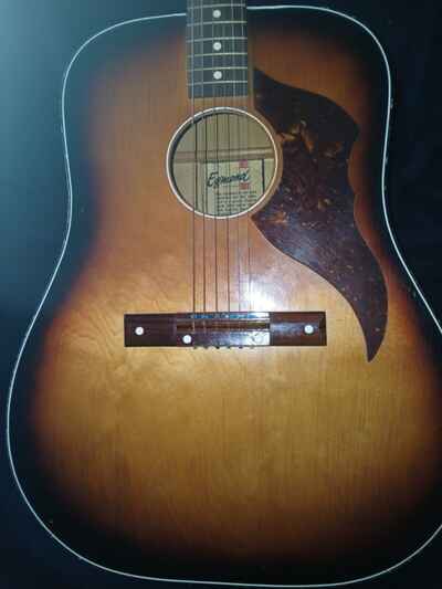 A vintage Egmond acoustic guitar in original case with stand