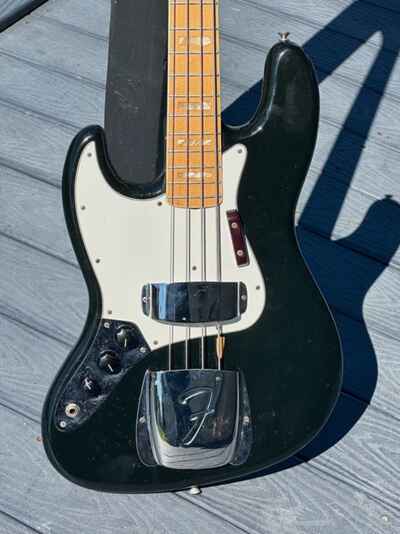 1974 Fender Jazz Bass a factory Left Handed clean example Black w / a Maple Neck.