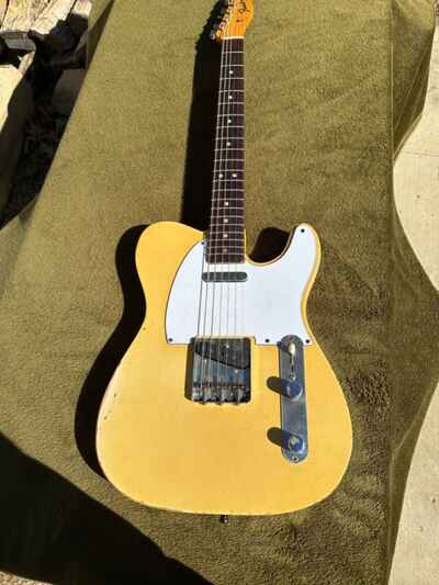 1966 Fender Telecaster guitar in excellent shape other than standard aging.