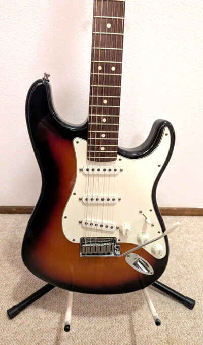 Fender Stratocaster guitar with hard shell case.