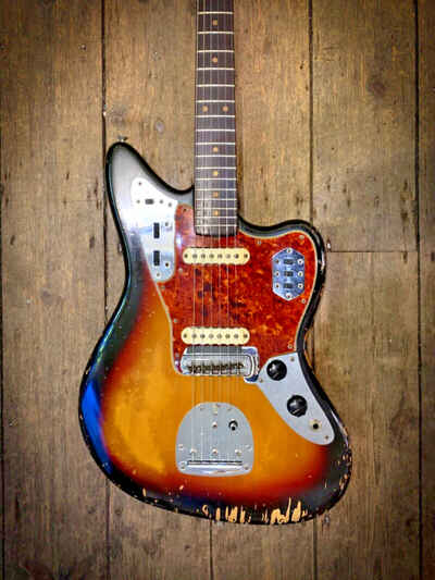 1964 Fender Jaguar in Sunburst finish. Comes with a later tweed hard shell case