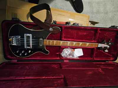 Rickenbacker 4001 bass guitar, from 1975.  Black, with ATA flight case and strap